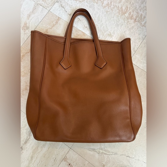 Hermes Tan Leather Tote Bag
Approx 16.5” high X 6”deep X 13” wide 6” strap drop - Picture 2 of 10